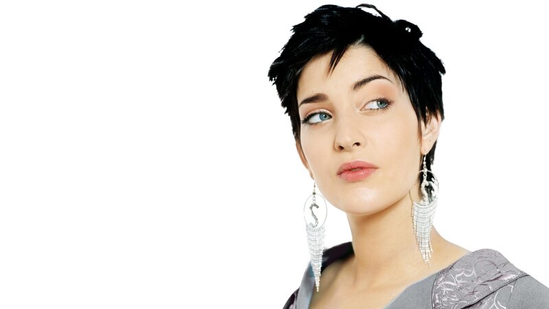 woman with short hair and earrings