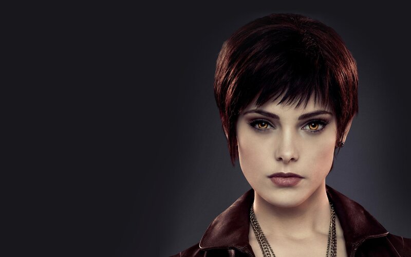 woman with short hair and golden eyes