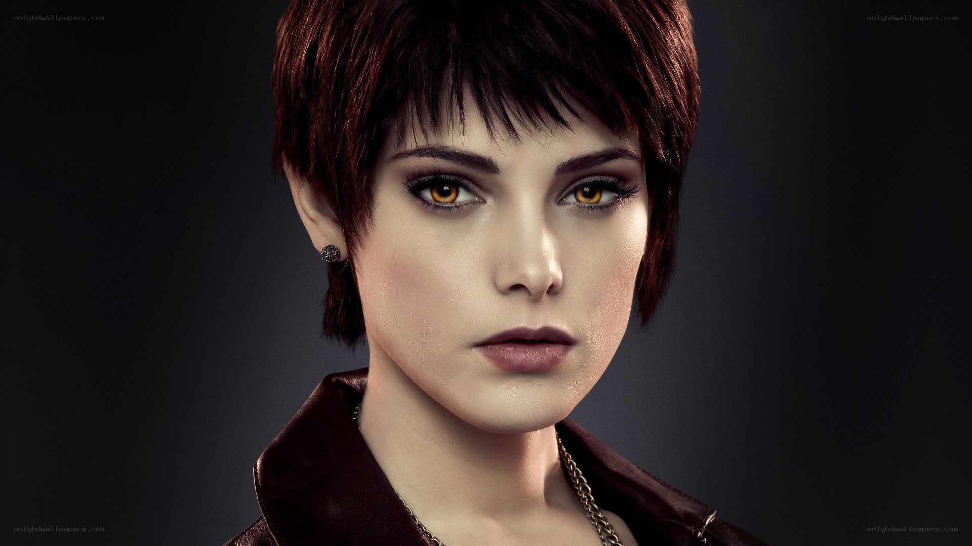 woman with short hair and golden eyes