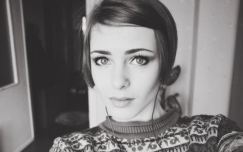 woman with short hair and headphones