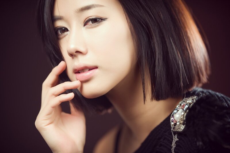 woman with short hair and jewelry