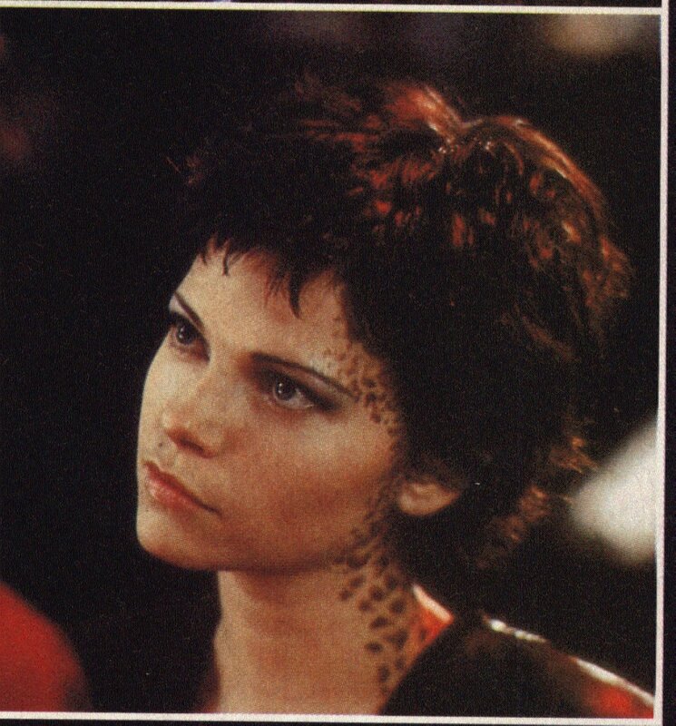 woman with short hair and neck tattoo