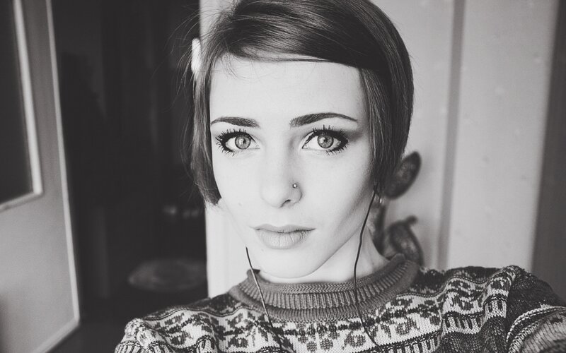 woman with short hair and nose piercing