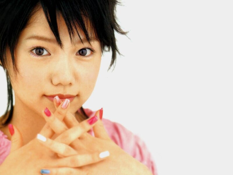 woman with short hair and painted nails