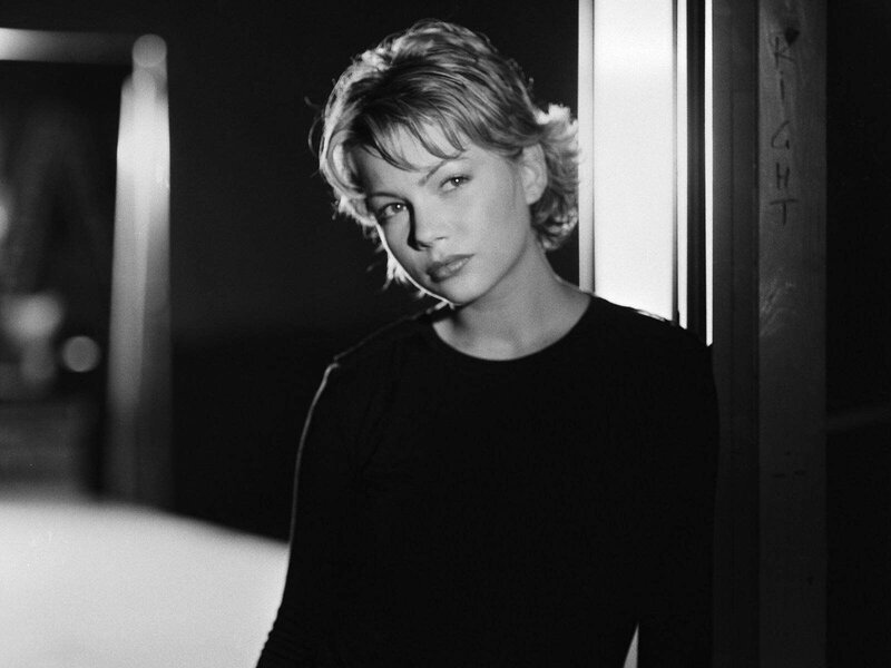 Woman with Short Hair — Black, Dramatic, Photograph, Black Shirt, Door Frame