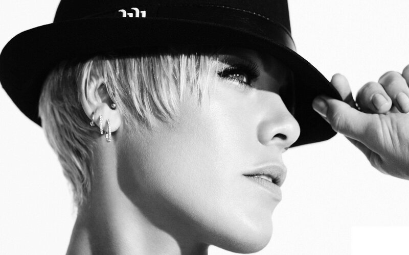 Woman with Short Hair — Black, Dramatic, Photograph, Hat, Earrings
