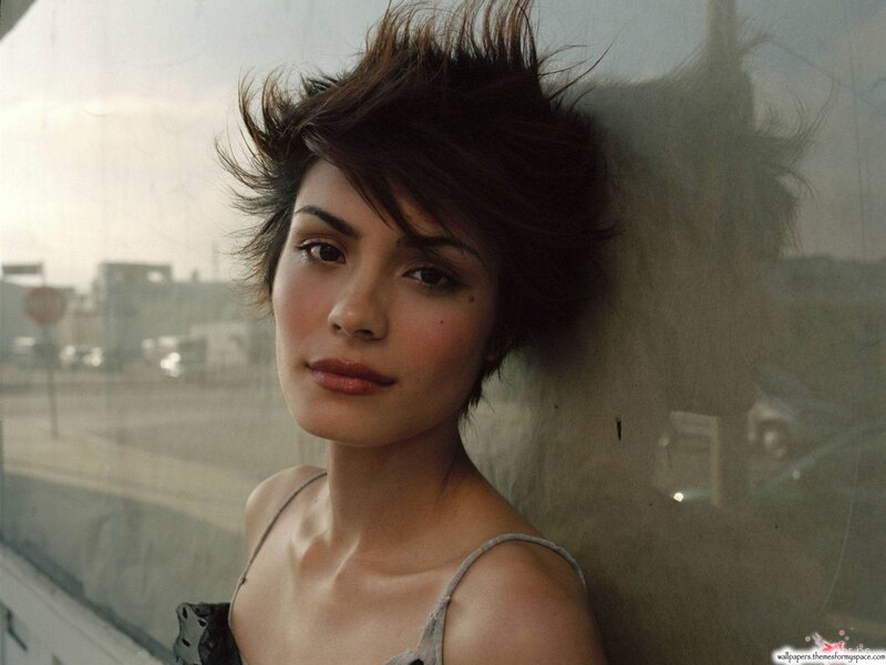 woman with short hair by window