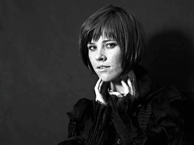 woman with short hair in black and white