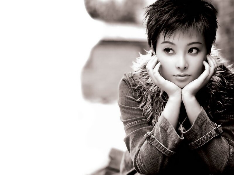 woman with short hair in black and white