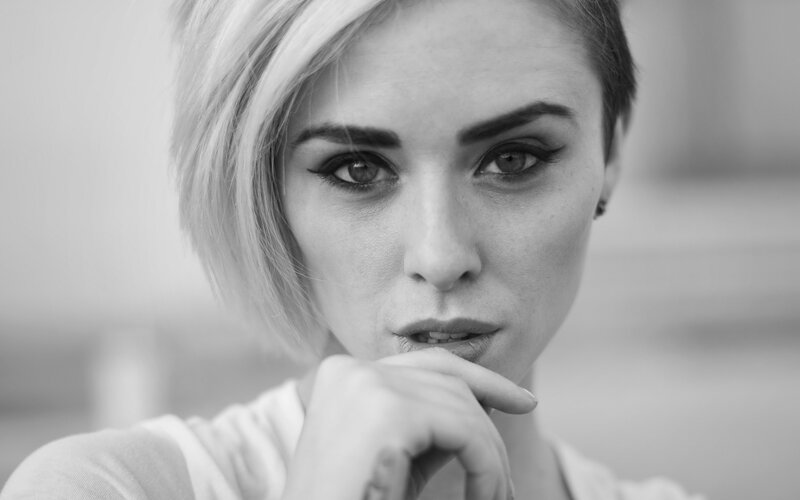 woman with short hair in black and white