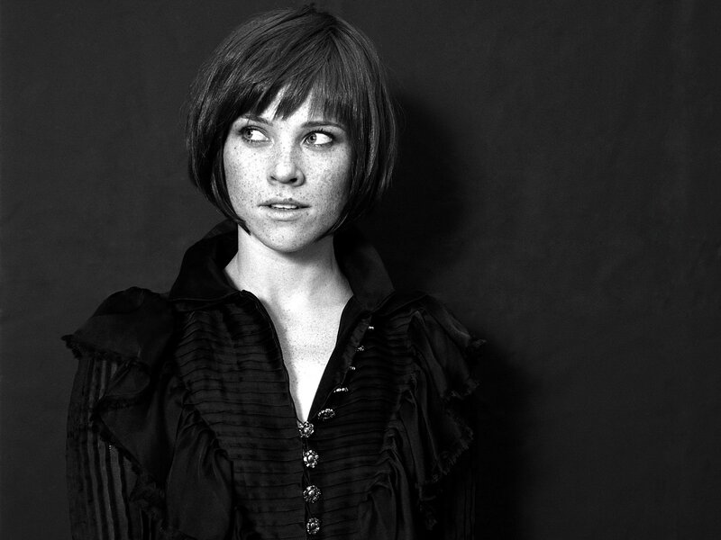 woman with short hair in black and white