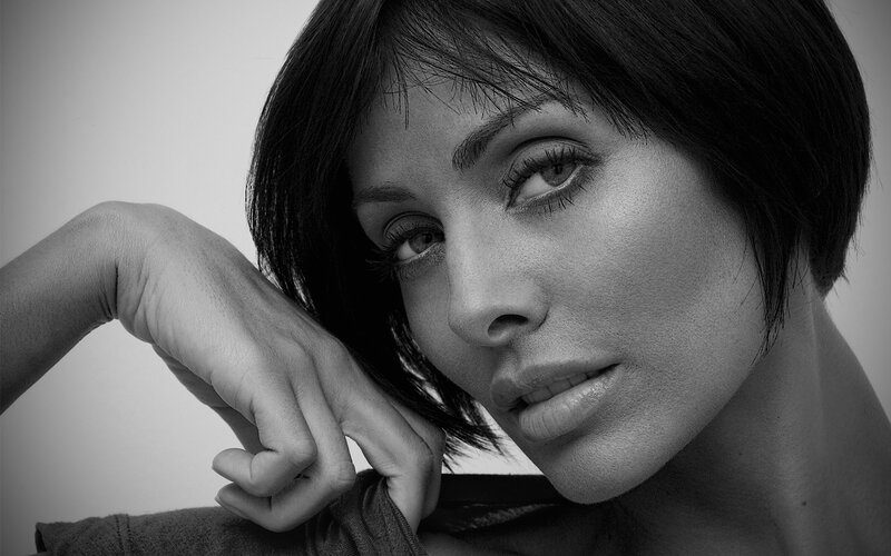 woman with short hair in black and white