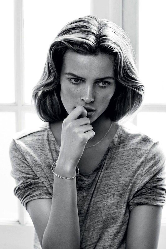woman with short hair in black and white