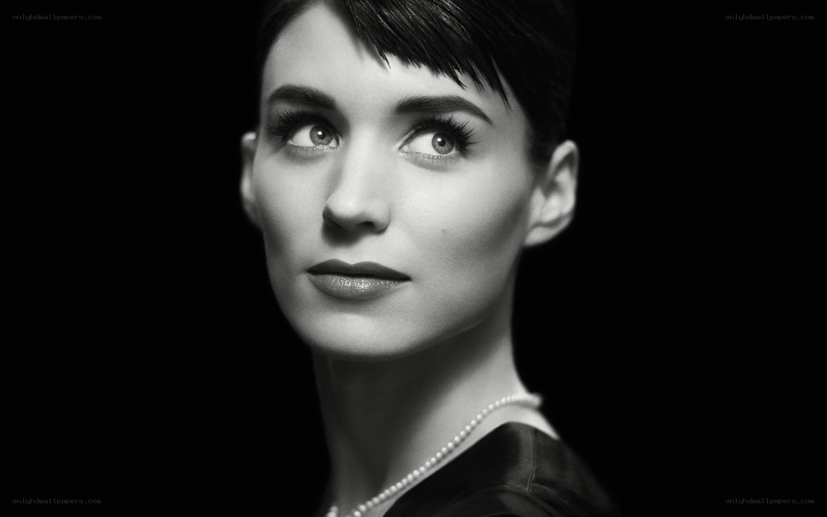 woman with short hair in black and white