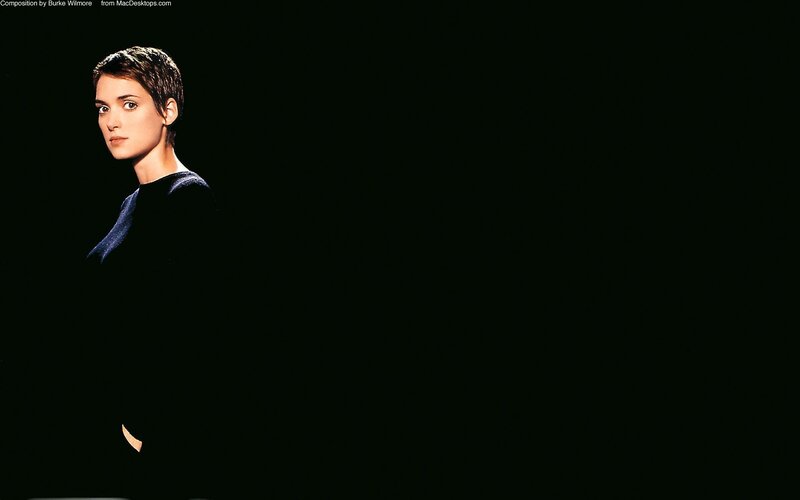 woman with short hair in dark setting