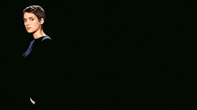 woman with short hair in dark setting