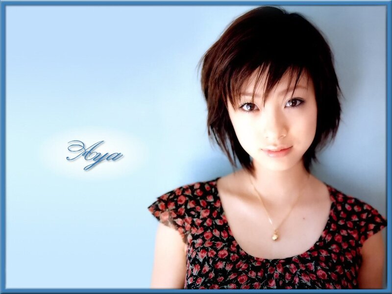 woman with short hair in floral dress