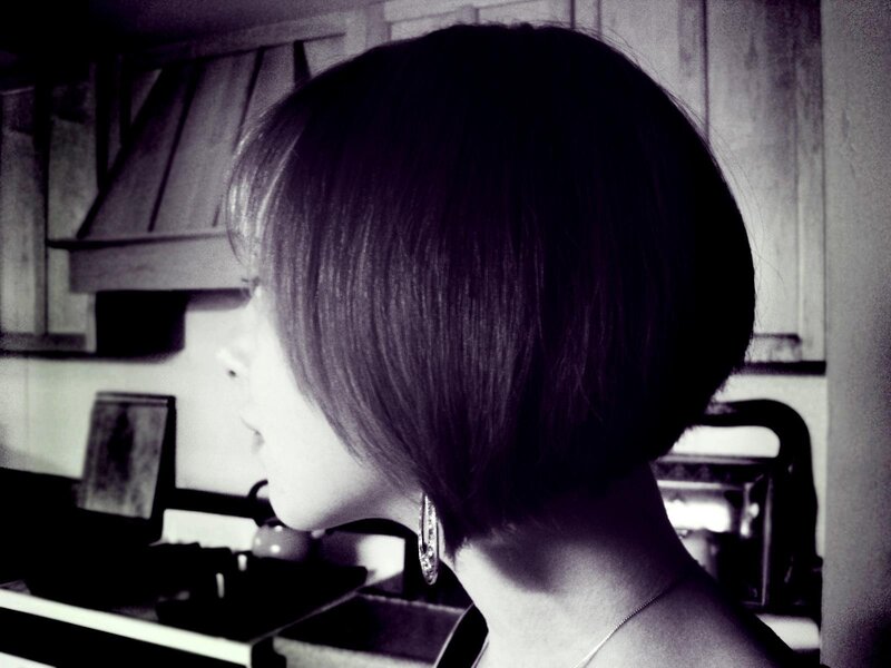 woman with short hair in kitchen