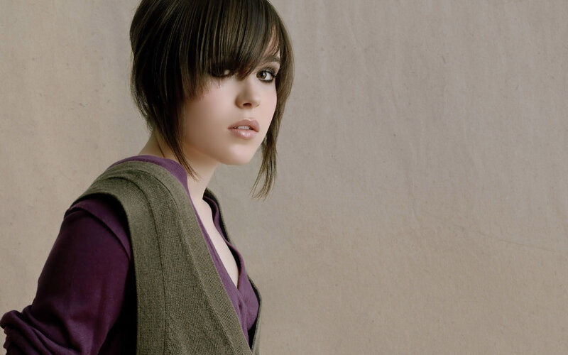 woman with short hair in purple top