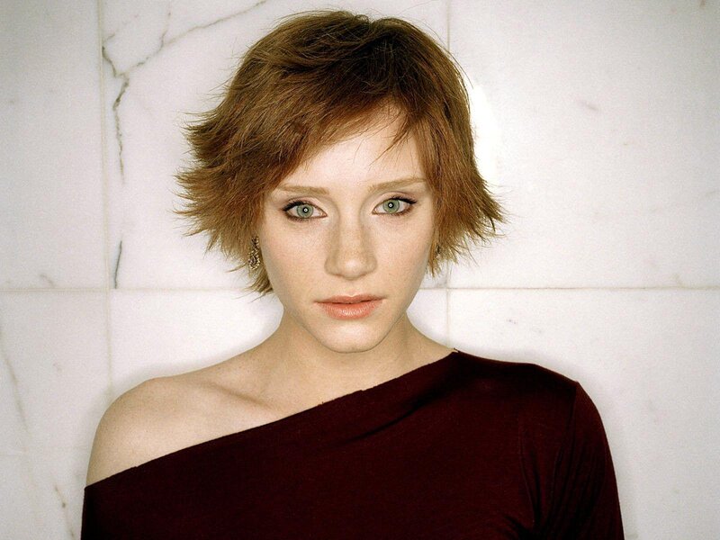 woman with short hair in red dress