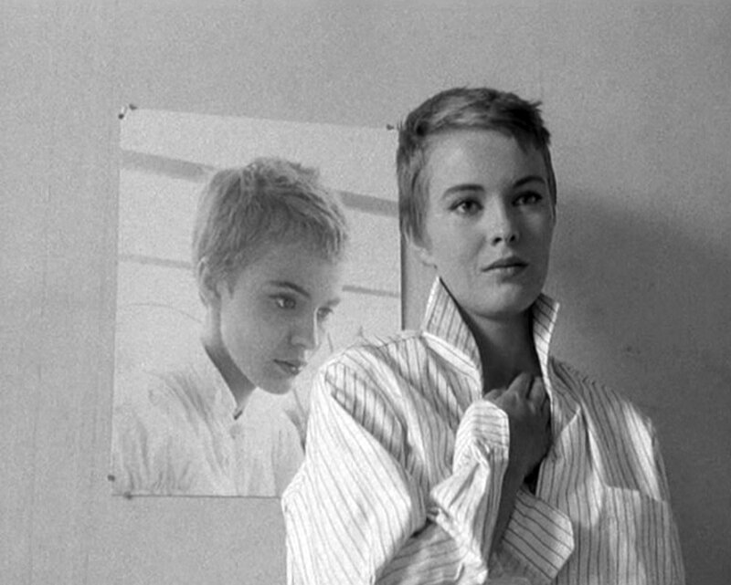 woman with short hair in striped shirt
