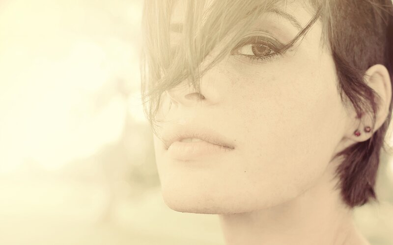 woman with short hair in sunlight