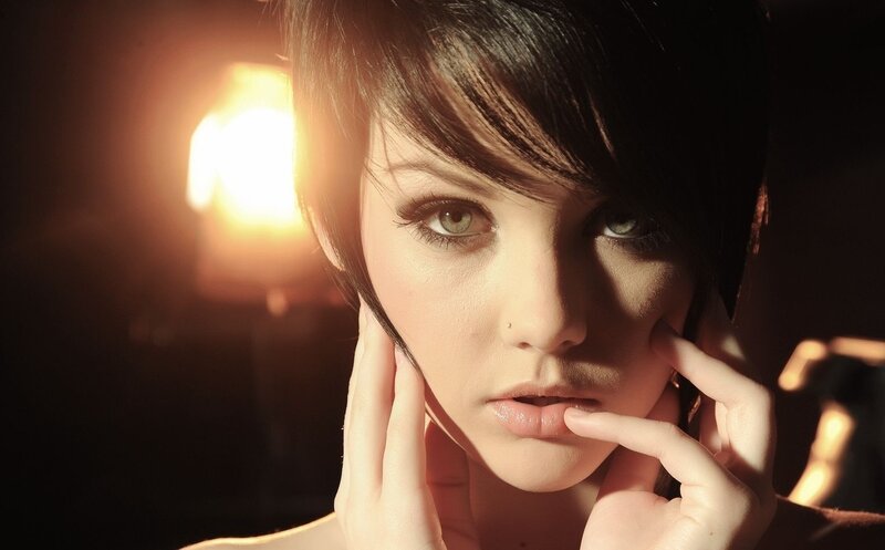 woman with short hair in warm light
