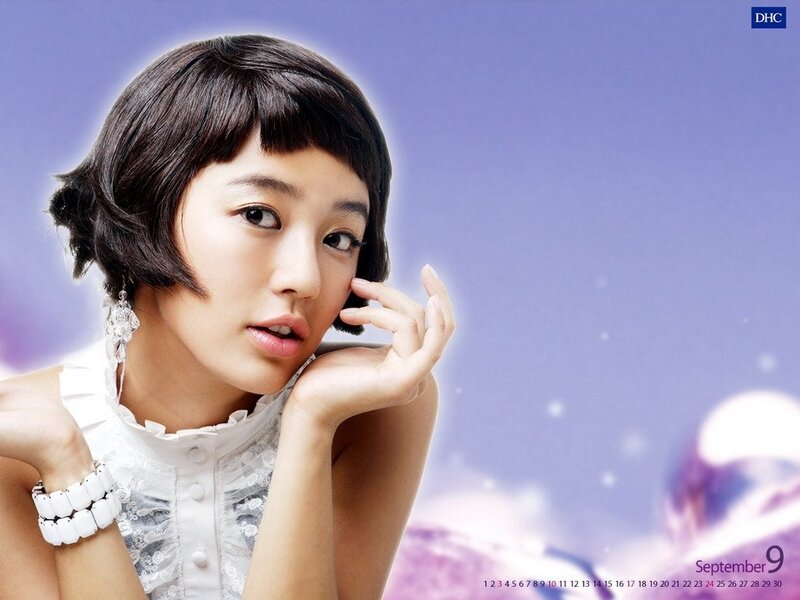 woman with short hair in white dress