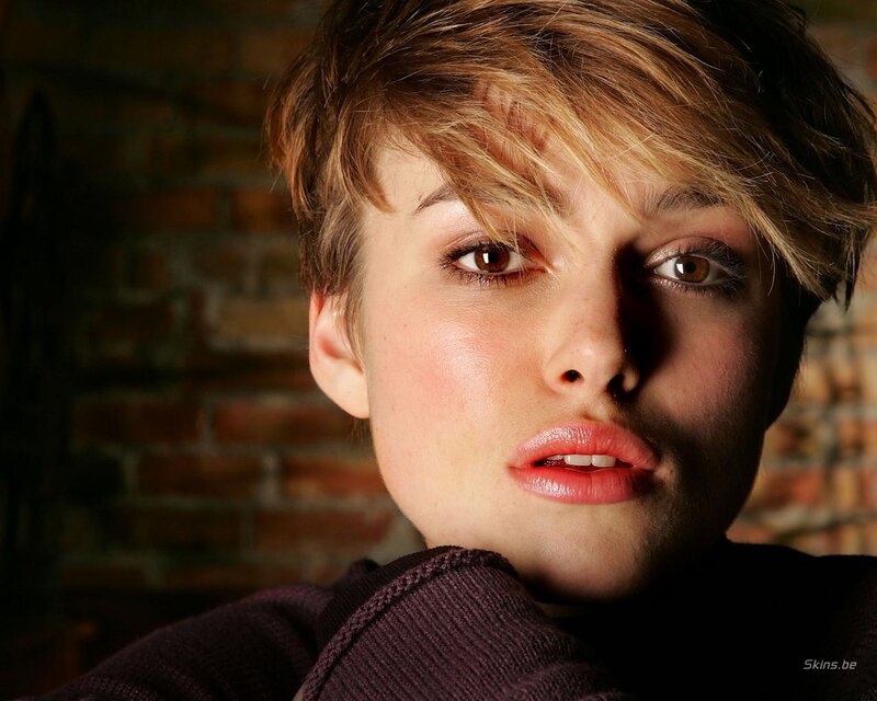 woman with short hair looking at camera