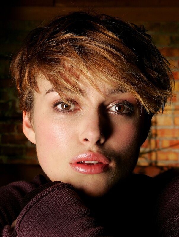 woman with short hair looking at camera