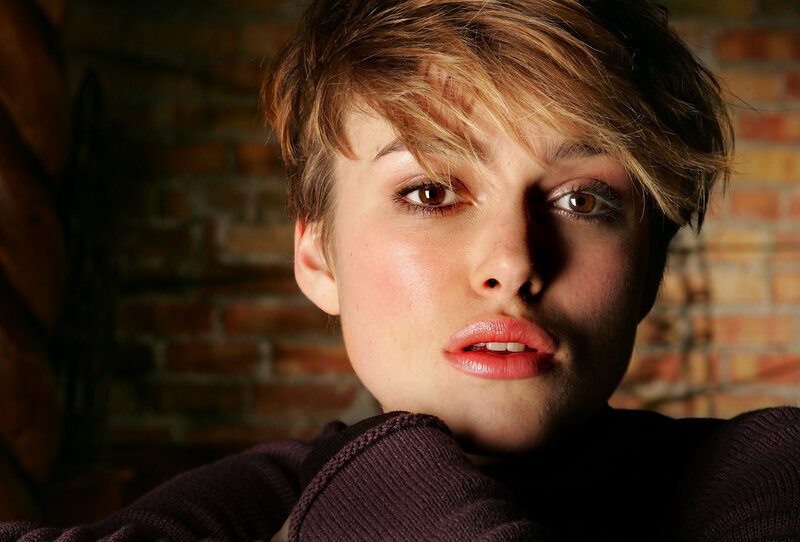 woman with short hair looking at camera