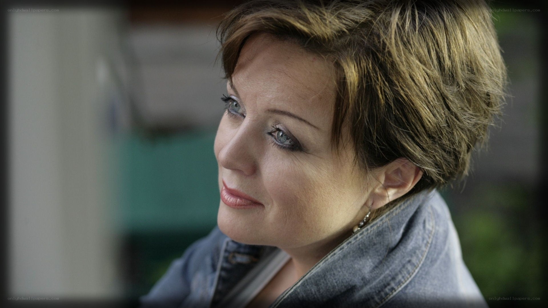 woman with short hair looking away