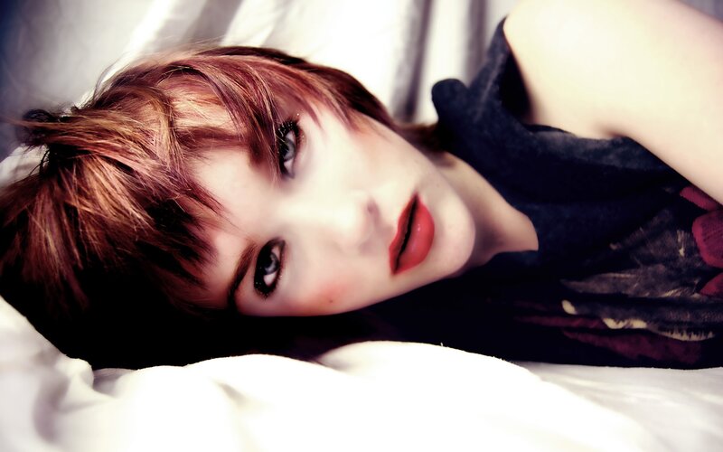 woman with short hair lying down