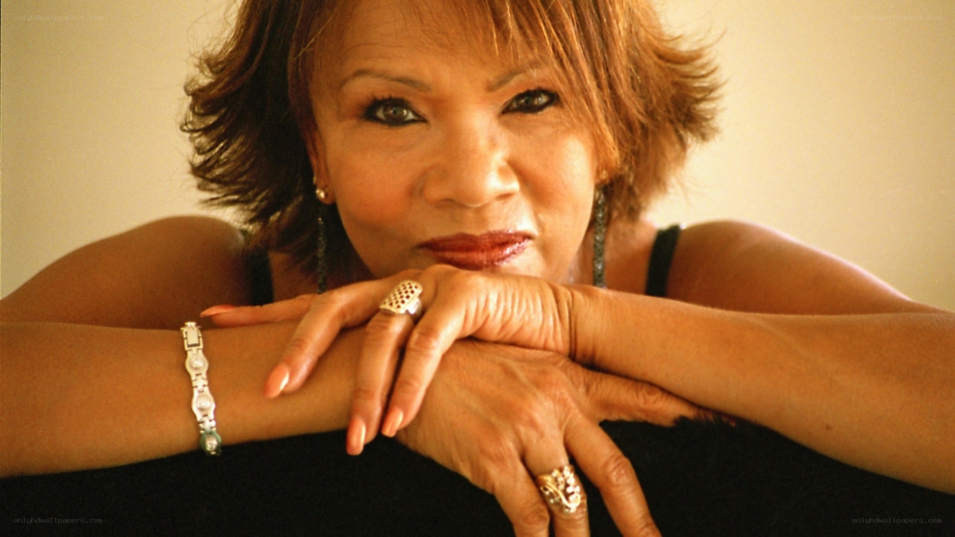 woman with short hair resting arms