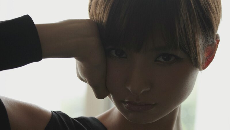 woman with short hair resting head