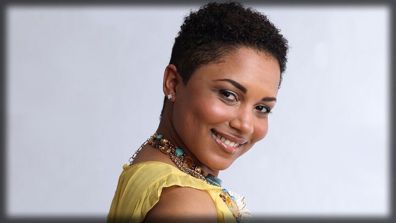 woman with short hair smiling