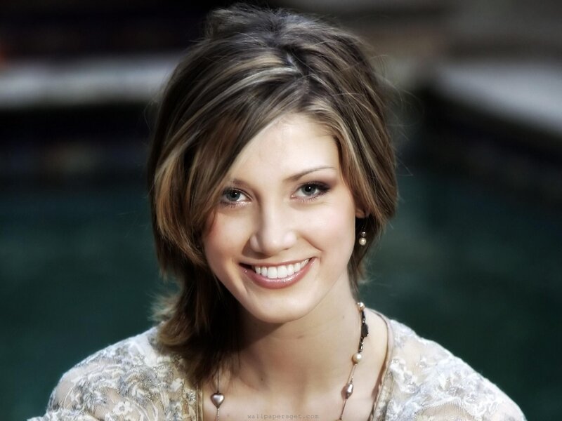 woman with short hair smiling