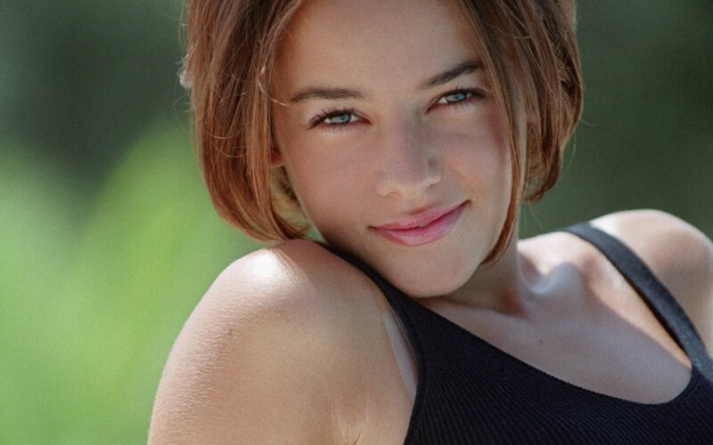 woman with short hair smiling