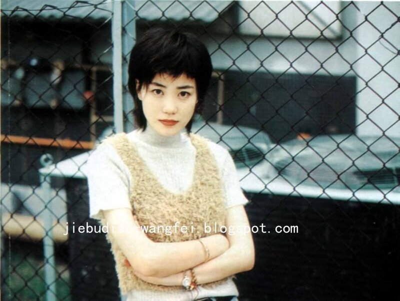 woman with short hair standing