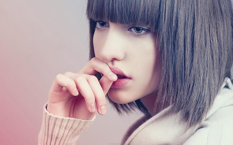 woman with short hair thinking