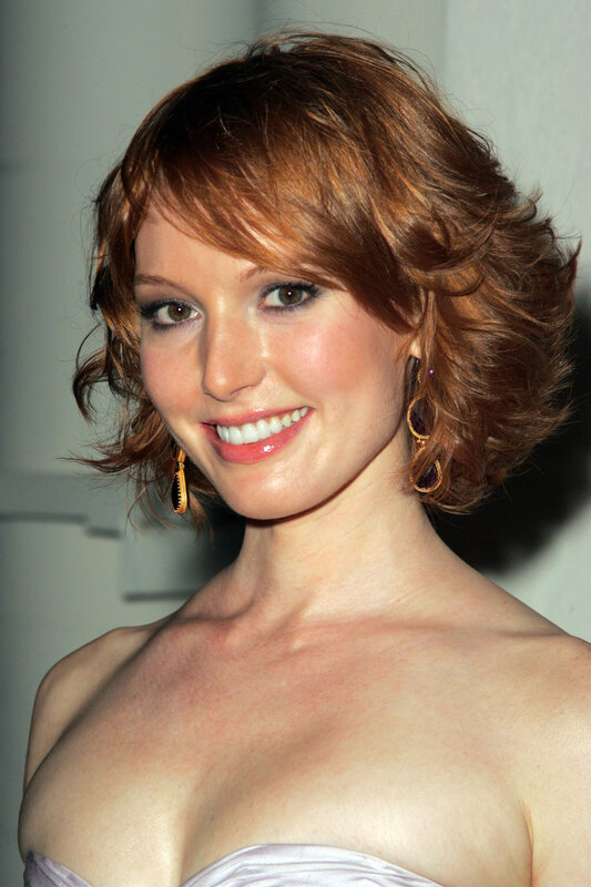 woman with short red hair smiling