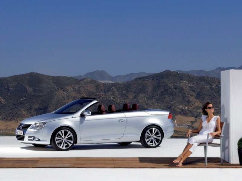 Woman with silver convertible car