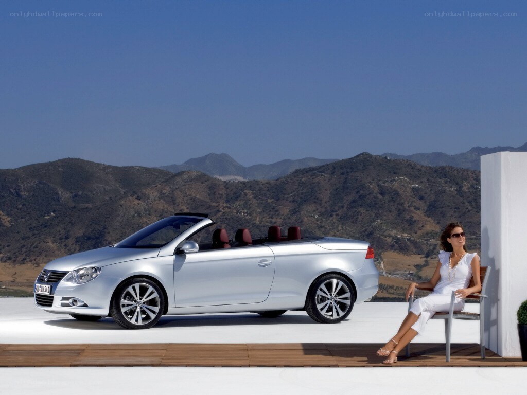 Woman with silver convertible car
