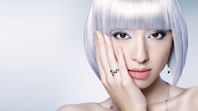 woman with silver hair and makeup