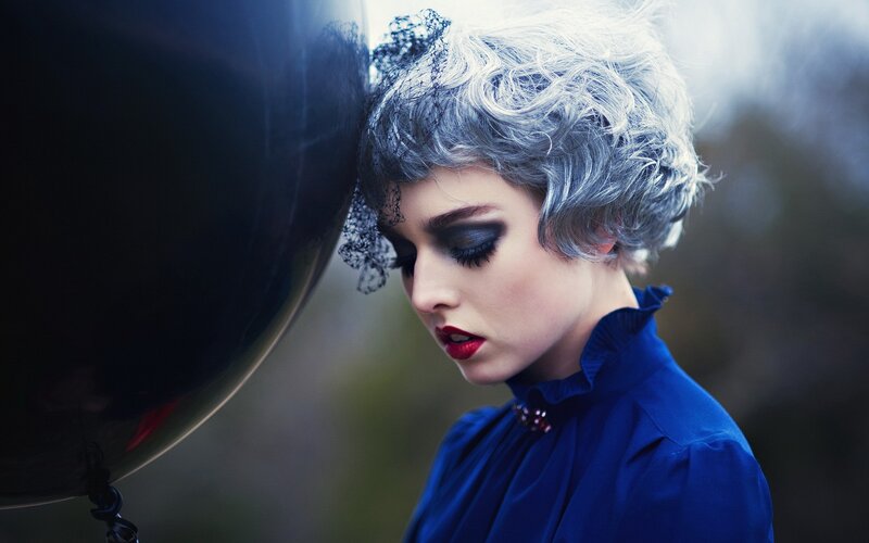 woman with silver hair and red lips