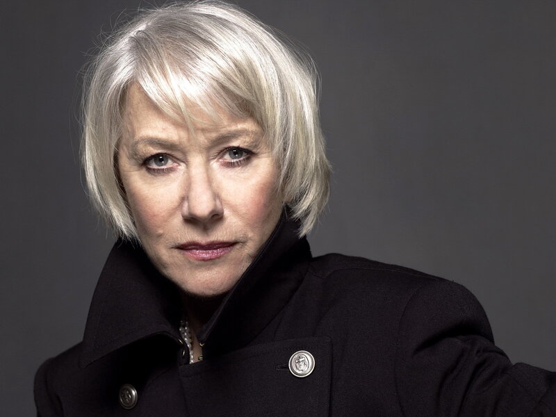woman with silver hair in black coat