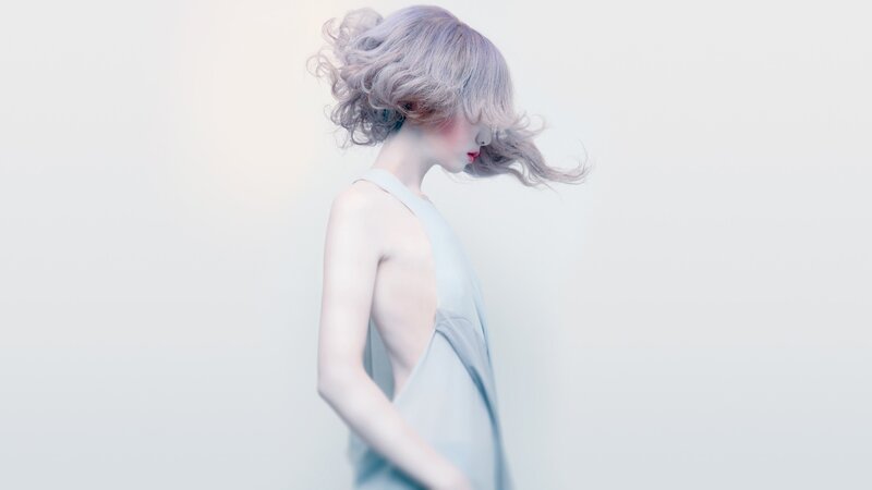 woman with silver hair in profile