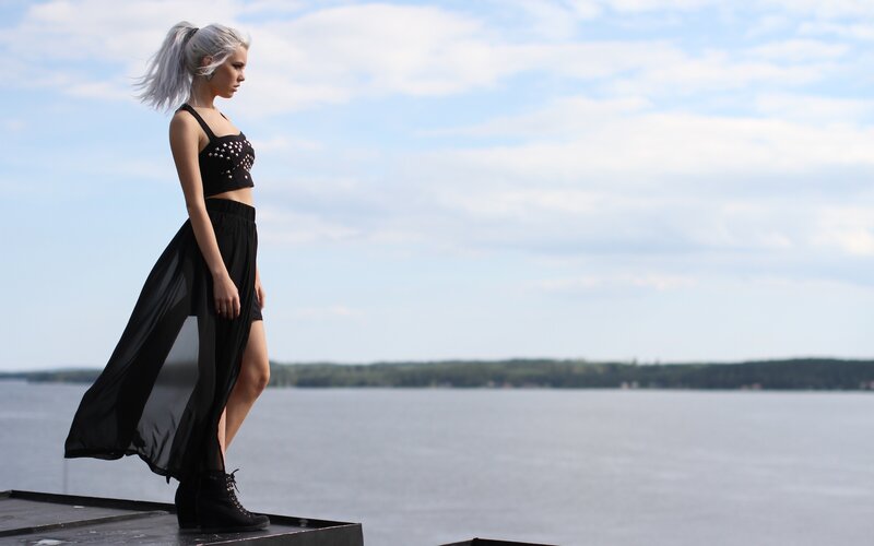 Woman with silver hair on a dock