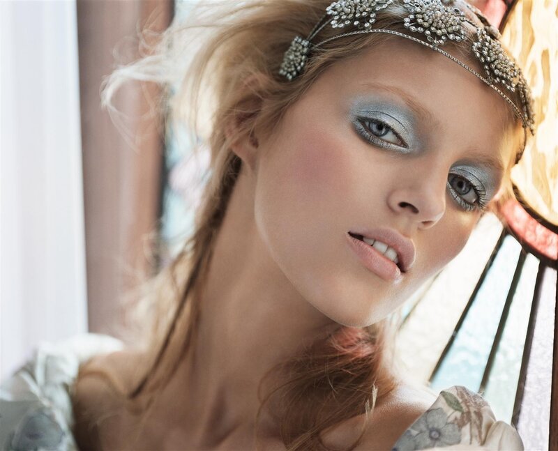 woman with silver makeup and headpiece