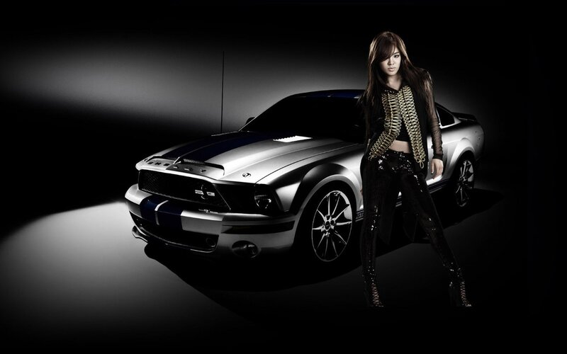 woman with silver muscle car